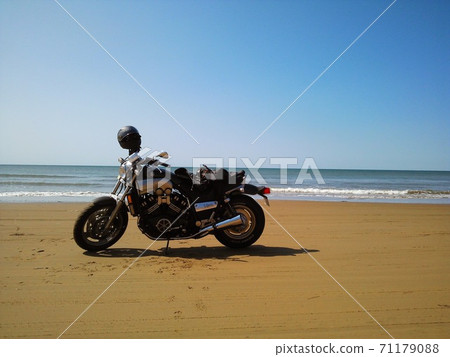Sandy beach on a motorcycle Sandy beach on a motorcycle 71179088