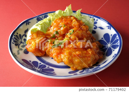 Simply shoot shrimp in chili sauce on a red background 71179402