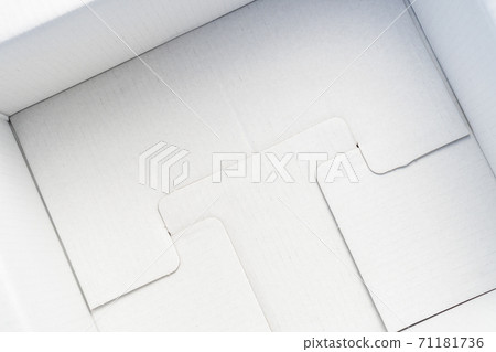 White cardboard packing box from the inside close up. Delivery concept of goods and products White cardboard packing box from the inside close up. Delivery concept of goods and products 71181736