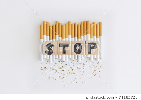 cigarette cube Overhead view of stop text wood cube from... - Stock Photo [71183723]