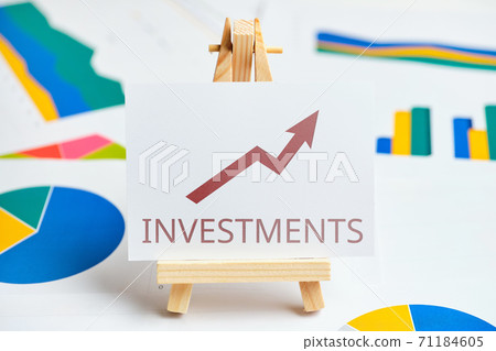 Investment growth concept with graphs and reports Investment growth concept with graphs and reports 71184605
