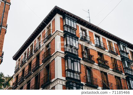 Low angle view of old residential building in Lavapies quarter in Madrid Low angle view of old residential building in Lavapies quarter in Madrid 71185466
