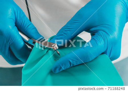 Dental procedure, installation of a cofferdam to the patient, modern treatment, preparation for installation. 71188248