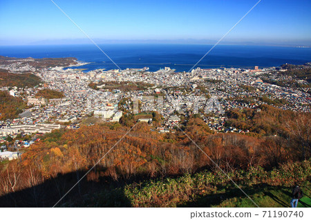 City of Otaru seen from Mt. Tengusan in autumn and mountains over Ishikari Bay 71190740
