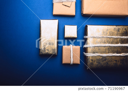 Eco friendly gifts wrapped in brown paper Eco friendly gifts wrapped in brown paper 71190967