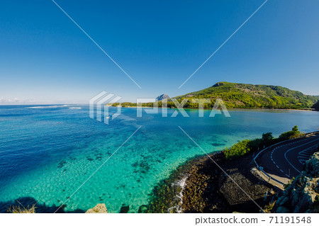 View to Le Morne from Maconde point with ocean and sunlight in Mauritius Island 71191548