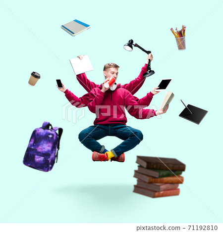 Handsome multi-armed student levitating isolated on blue studio background with equipment 71192810