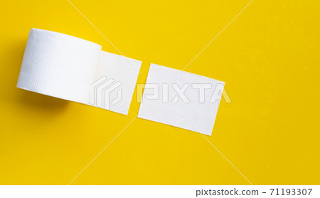 Toilet paper on yellow background. Copy space Toilet paper on yellow background. Copy space 71193307