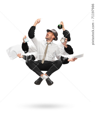 Handsome multi-armed journalist levitating isolated on yellow studio background with equipment Handsome multi-armed journalist levitating isolated on yellow studio background with equipment 71197986