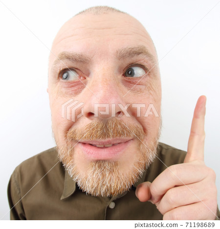 Bearded man pointing his index finger up Bearded man pointing his index finger up 71198689