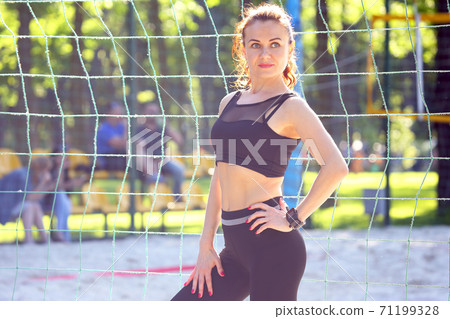 beautiful sports girl standing near the sports complex 71199328