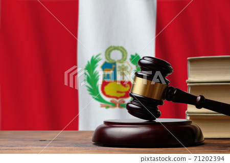 Justice and court concept in Republic of Peru. Judge hammer on a flag background Justice and court concept in Republic of Peru. Judge hammer on a flag background 71202394