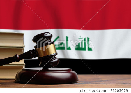 Justice and court concept in Republic of Iraq. Judge hammer on a flag background Justice and court concept in Republic of Iraq. Judge hammer on a flag background 71203079