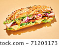 Sandwich with ham and vegetables on light brown 71203173