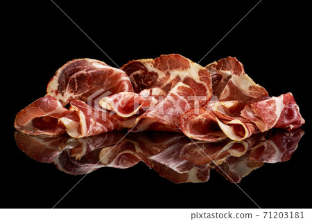 Basturma meat on black with reflection  71203181