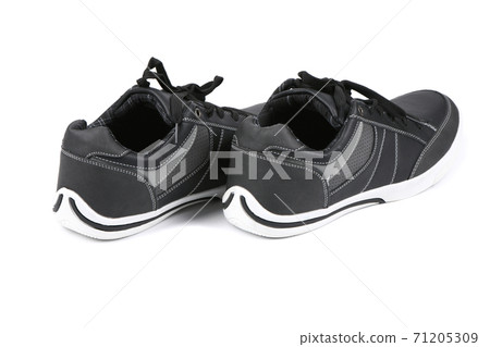 Pair of black women sneakers isolated on white Pair of black women sneakers isolated on white 71205309
