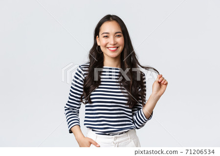 Lifestyle, people emotions and casual concept. Stylish beautiful smiling asian woman touching hair strand, made new haircut or bought good haircare product, standing white background Lifestyle, people emotions and casual concept. Stylish beautiful smiling asian woman touching hair strand, made new haircut or bought good haircare product, standing white background 71206534