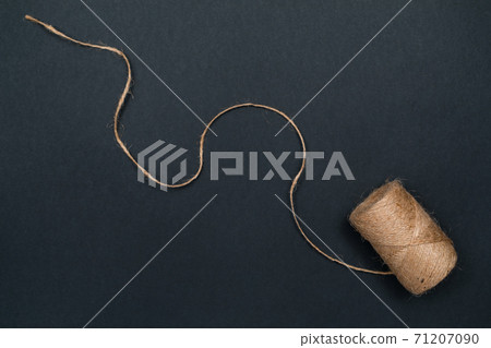 Hemp twine. Natural materials for crafts. Top view with copy space, flat lay. 71207090