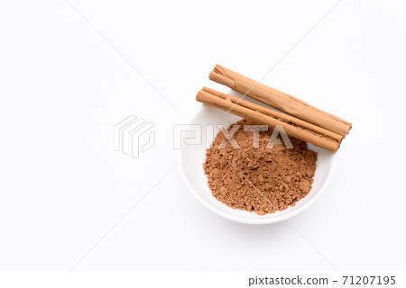 Cinnamon stick and cinnamon powder on the plate white background 71207195