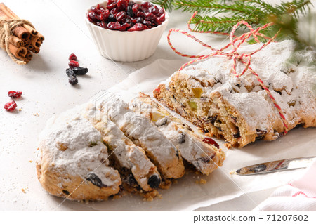 Christmas cutted stollen with raisin, cranberry. Christmas cutted stollen with raisin, cranberry. 71207602