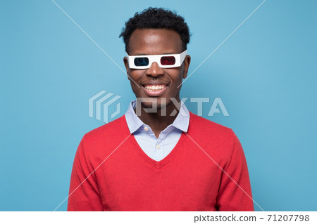 African american man in 3D glasses watching interesting movie on screen 71207798