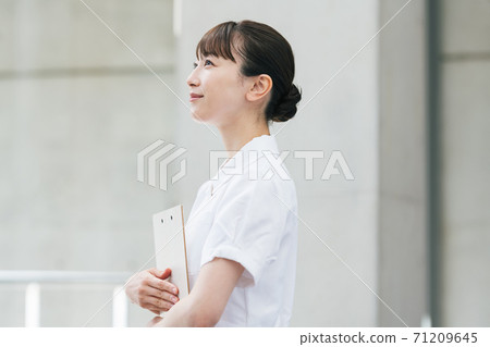 Portrait of a nurse working in a hospital 71209645