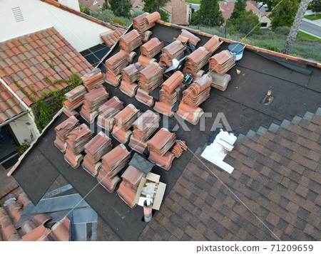 Aerial view over roof repair work Aerial view over roof repair work 71209659
