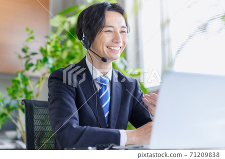 A businessman having an online meeting in the office A businessman having an online meeting in the office 71209838