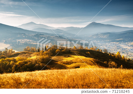 Picturesque autumn mountains with red beech forest 71210245