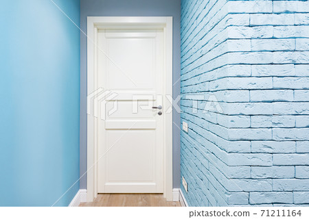 White door in the corridor. White door in the corridor. 71211164