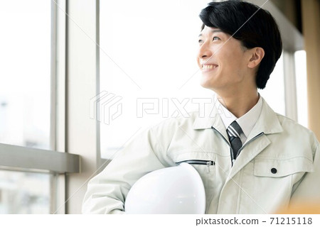 Young man managing a building Young man managing a building 71215118