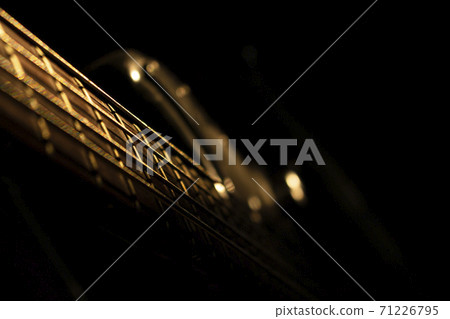 Bass guitar in music studio shot at golden hour Bass guitar in music studio shot at golden hour 71226795