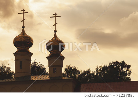 Silhouette photo of golden cupola of Tikhvin Cathedral 71227883