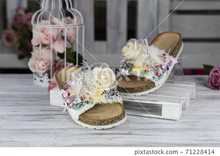 Luxury, fashionable female Slippers on rustic wooden surface 71228414