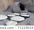 Clay oven with bread tidbit Clay oven with bread tidbit 71229634