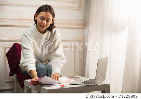 Woman writing letter, greeting card for New Year and Christmas 2021 for friends or family 71229902