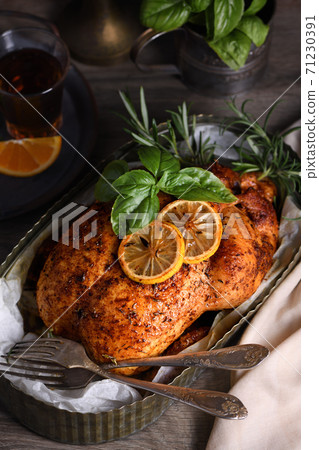 Baked whole chicken in a tray Baked whole chicken in a tray 71230391