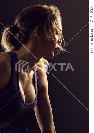 Slim beauty athletic woman on black background Slim beauty athletic woman on black background 71230583