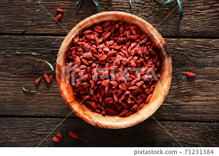 Dried goji berries on wooden background 71231384