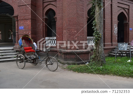 Dhaka, Bangladesh, a historic building, Curzon Hall, a rickshaw parked in front of a brick building Dhaka, Bangladesh, a historic building, Curzon Hall, a rickshaw parked in front of a brick building 71232353