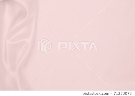 Smooth elegant pink silk or satin texture as wedding background. Luxurious background design Smooth elegant pink silk or satin texture as wedding background. Luxurious background design 71233073
