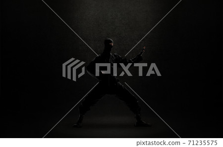 japanese ninja in black uniform on black background japanese ninja in black uniform on black background 71235575