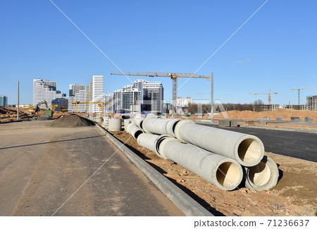 Concrete drainage pipes at the construction site.  71236637