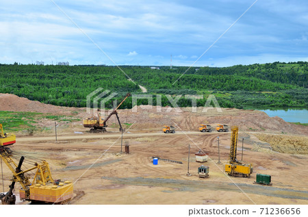 Huge excavators with electric shovel working in the quarry.  71236656