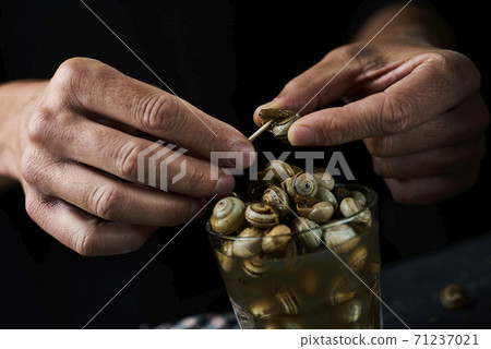 eating caracolillos, spanish recipe of snails eating caracolillos, spanish recipe of snails 71237021