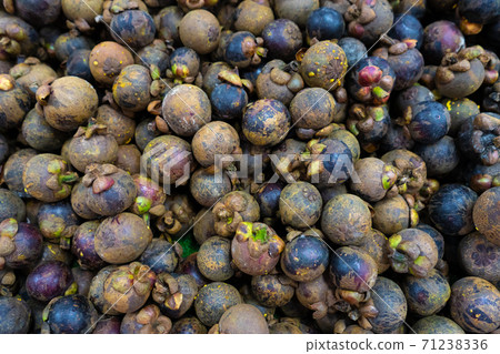 Mangosteen fruits fill the frame close up 71238336