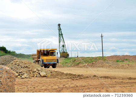 Big mining truck transport of minerals in the quarry.  71239360