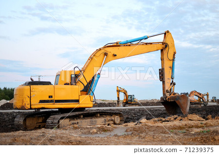 Large tracked excavator on a construction site.  71239375