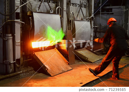 Steel quenching at high temperature in industrial furnace at the workshop of a forge plant Steel quenching at high temperature in industrial furnace at the workshop of a forge plant 71239385