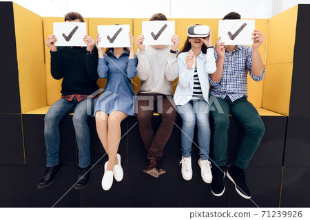 Admired girl looks into virtual reality glasses. Admired girl looks into virtual reality glasses. 71239926